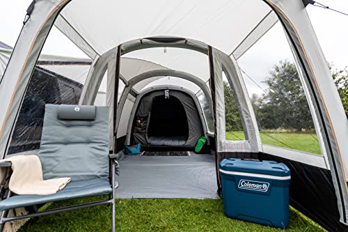 Glacière Coleman Xtreme utilisée dans une tente de camping spacieuse avec sol gris