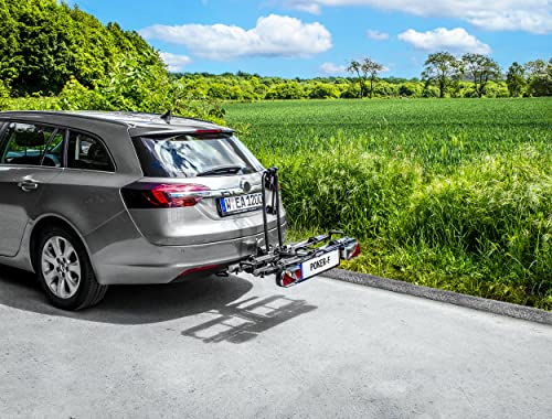 Porte-vélos EUFAB monté sur voiture grise dans paysage rural sans vélos